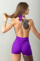 Body corto azul con transparencias y bordados florales